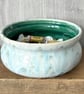 Ceramic hand thrown bowl with white and green drippy glaze