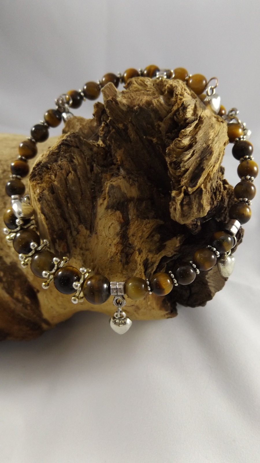 Tiger's eye memory wire bracelet with silver plated puffed heart charms