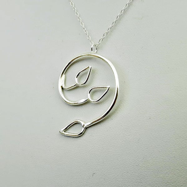 Silver Spiral Pendant with Three Open Leaves. 