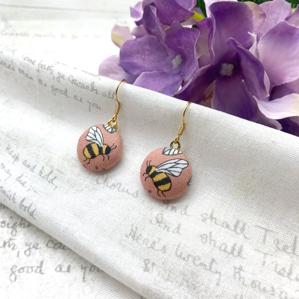 Bee fabric button earrings on pink background nature lovers