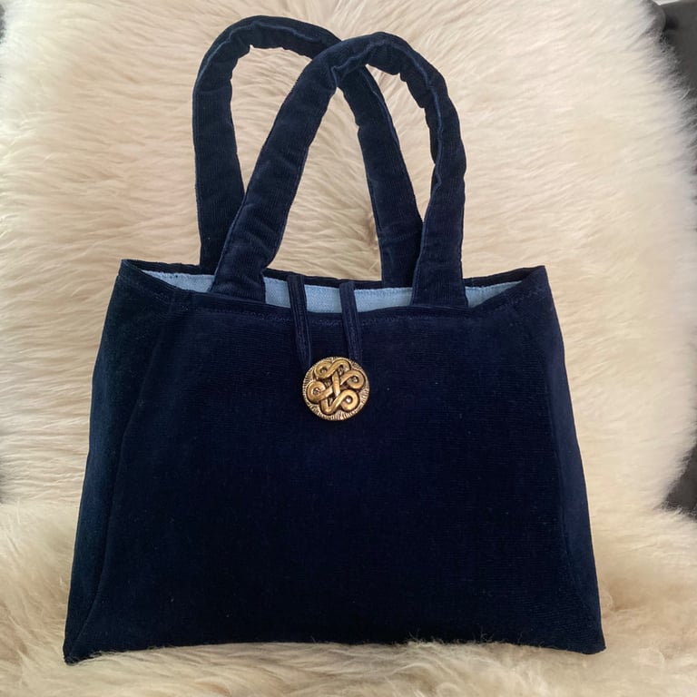 Stylish soft corduroy "Bretay" evening bag with vintage button fastening.