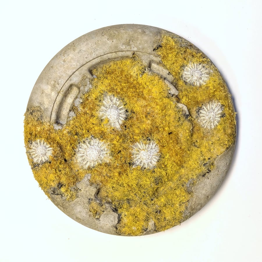 Beached round yellow wall plaque from recycled materials