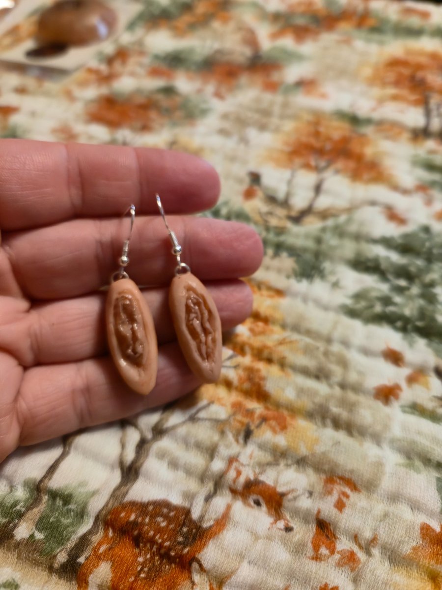 Serial killer trophy Vulva earrings