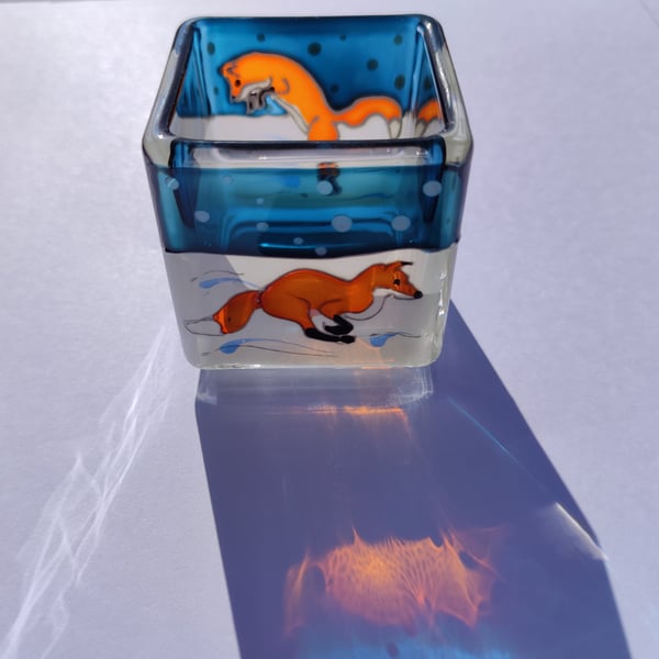 Hand painted glass candle holder, foxes hunting in the snow