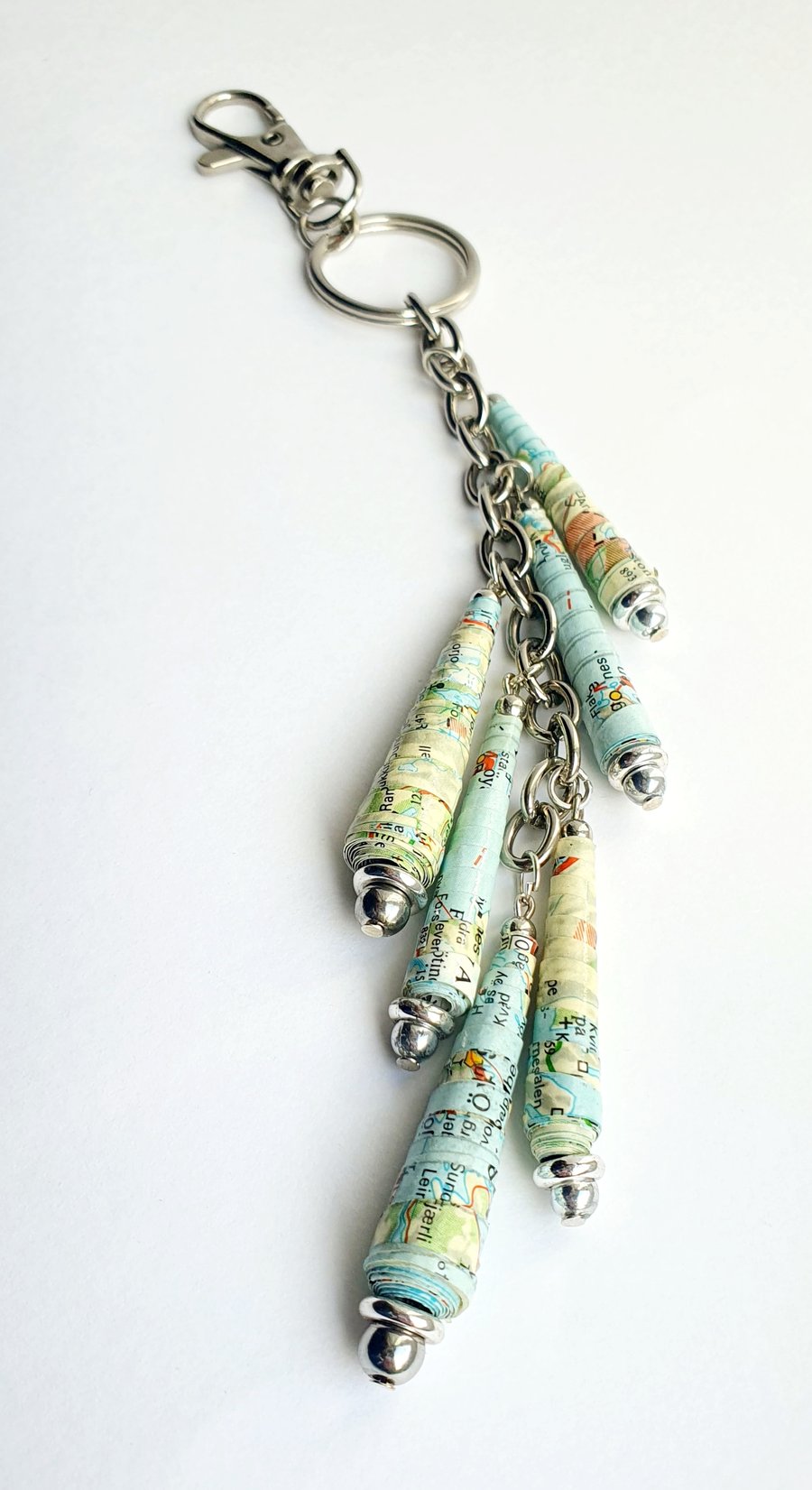 Keyring with thin, conical paper beads  made from an old map of Norway