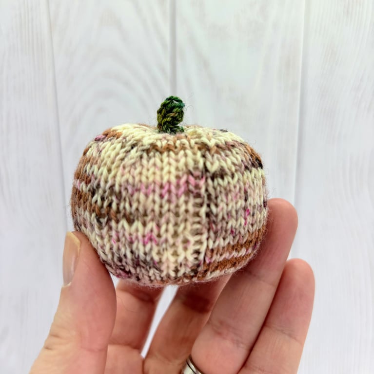 Hand knitted mini pumpkin pin cushion variegated pinks and brown