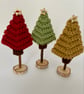 Mini Christmas Trees on Stand in Traditional Colours of Red, Green, and Gold - Image 1