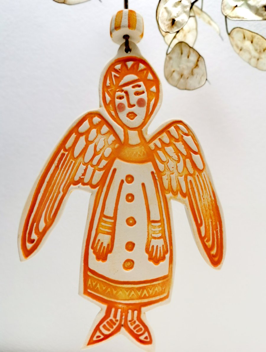 Ceramic Angel decoration in burnt orange