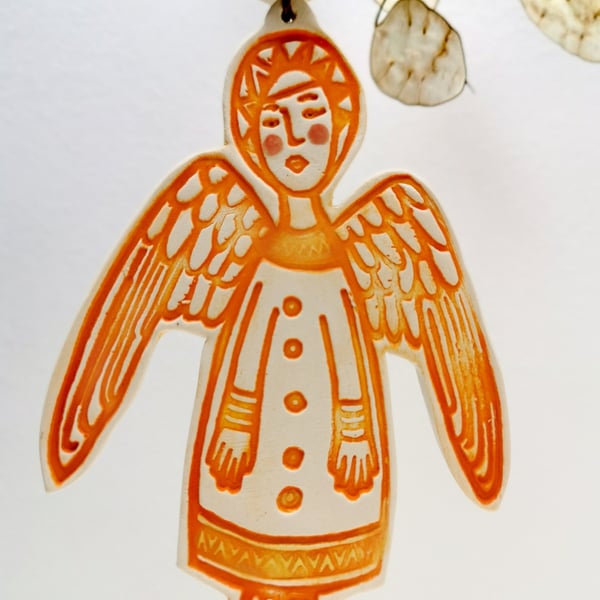 Ceramic Angel decoration in burnt orange