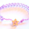 Lilac beaded bracelet with wooden star button.