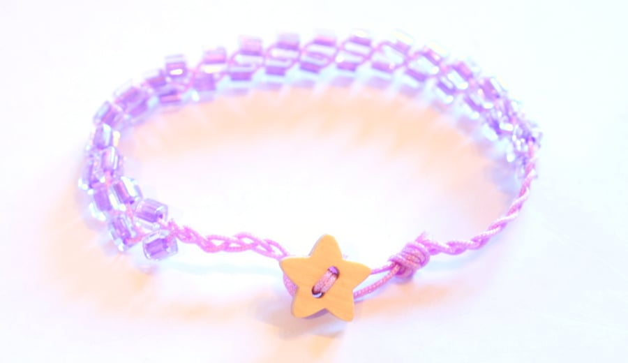 Lilac beaded bracelet with wooden star button.