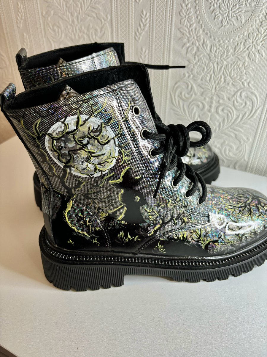 A pair of hand painted and sealed boots by Andrew Jenkins