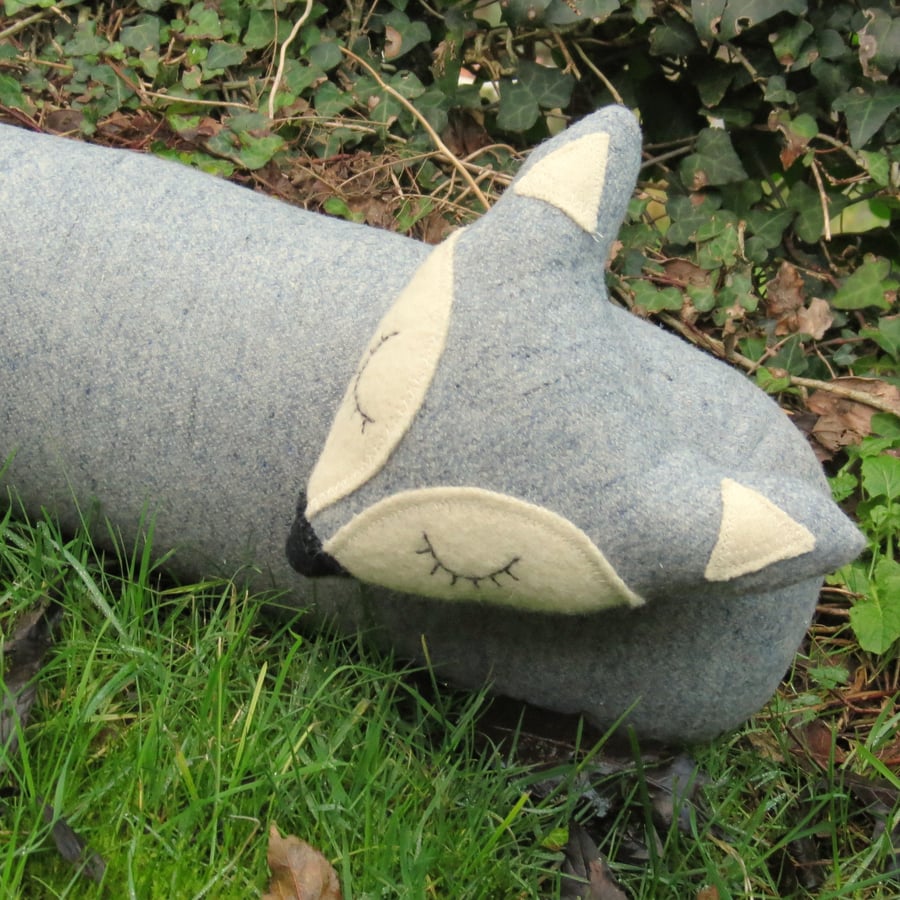 Long fox.  A draught excluder made from a soft marl grey wool.  102cm in length.