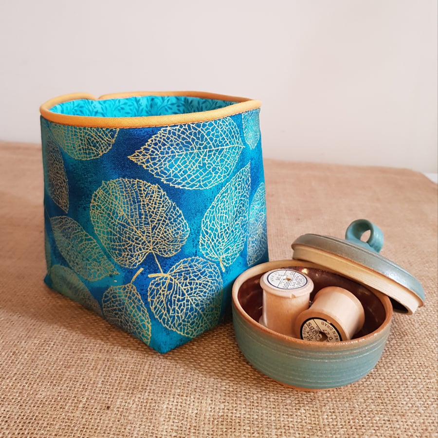 Fabric storage container: golden leaves on turquoise 