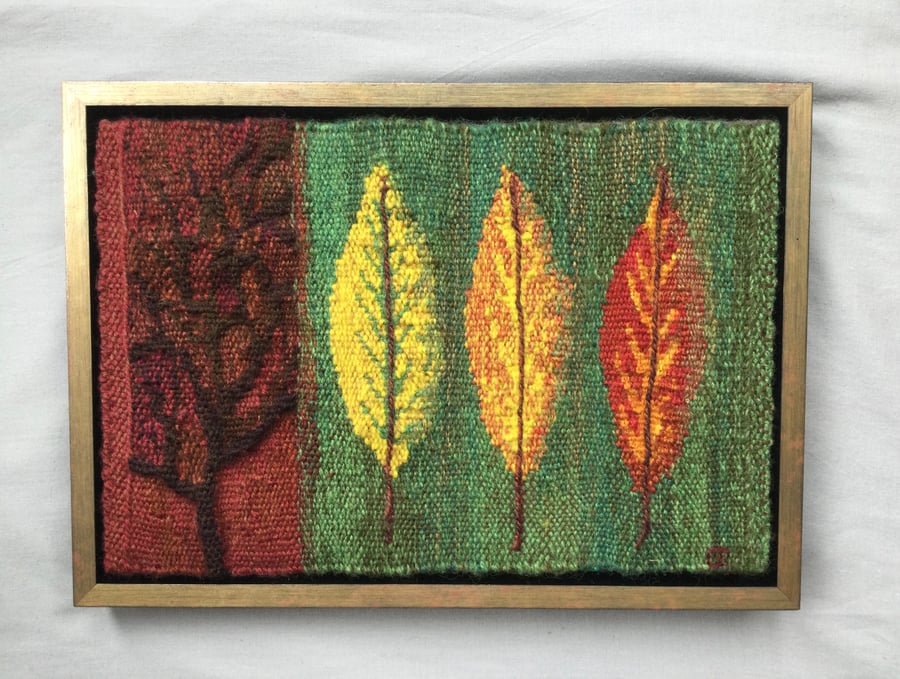 Framed handwoven tapestry weaving, textile art in red, green, orange and yellow