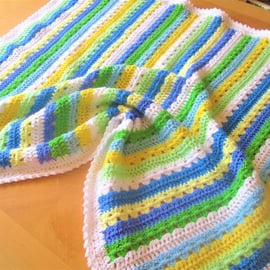 Handmade crochet baby or toddler blanket in white, blue, green and yellow 