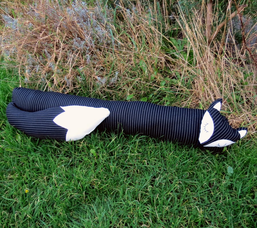 SALE!!!  A snoozy fox draught excluder in dapper pinstripe.