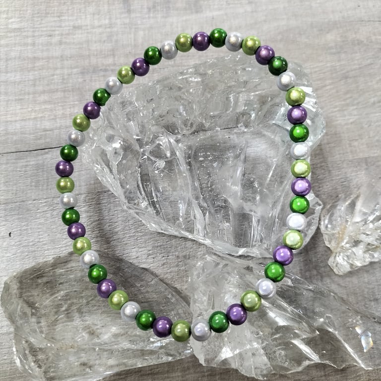 AL145B  Purple, greens and silver miracle bead elasticated anklet , 10.5"