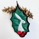 Upcycled embroidered holly leaf and berries hare home decoration. 