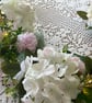 Handmade floral multi coloured, multi flowered garland table decoration. - Image 5