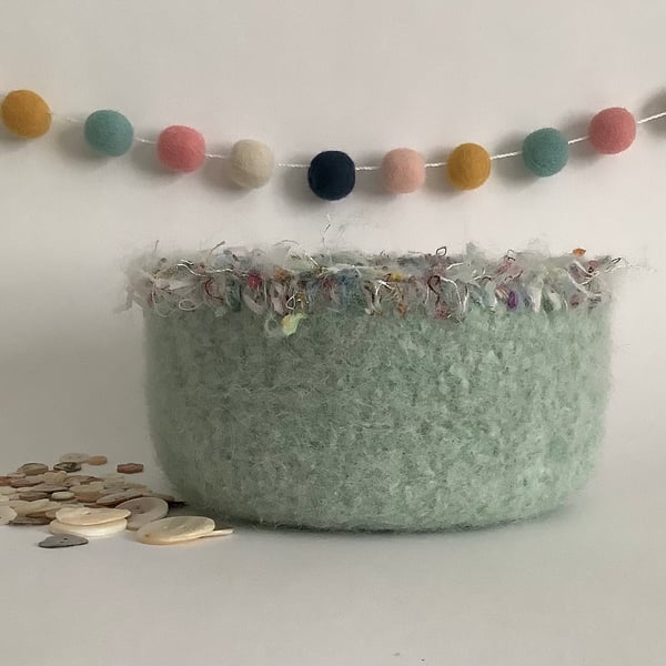 FELTED 'FUSSPOT'  BOWL ,desk tidy .Pastel green ( with decorative trim ).