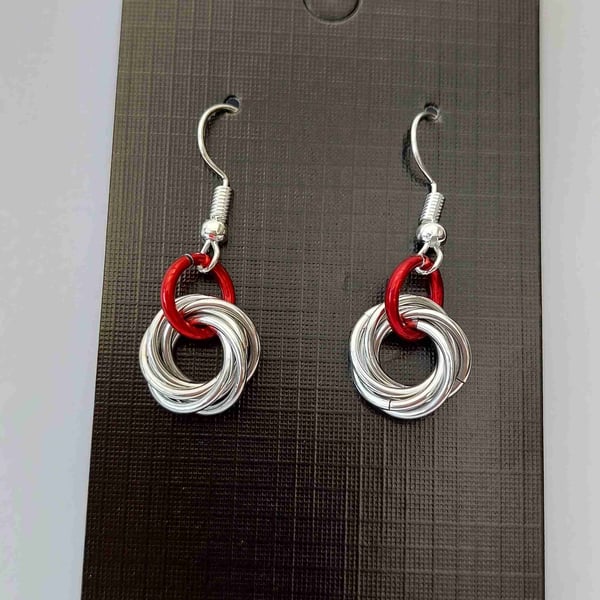 Earrings in red and silver anodised aluminium.