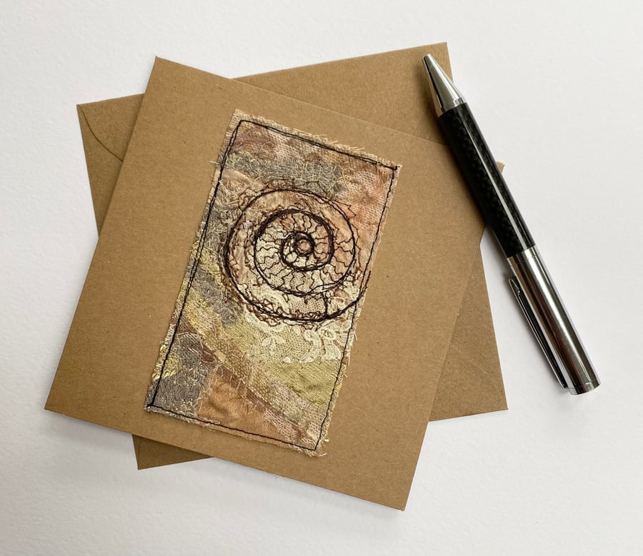 Up-cycled embroidered fossil ammonite card. 