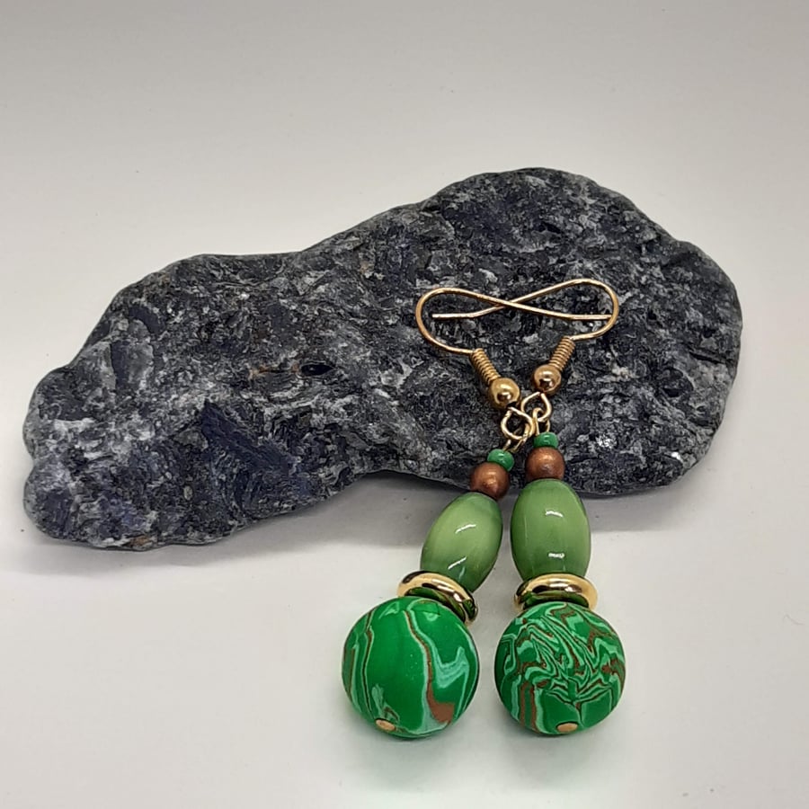 Green and gold dangly earrings