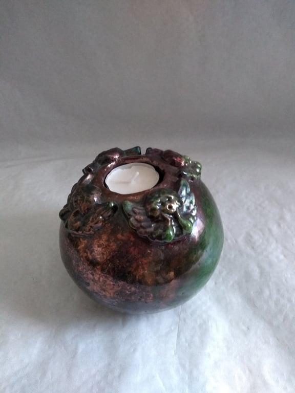 CERAMIC CANDLE HOLDER  RAKU FIRED WITH 4 DECORATIVE ANGELS 12 CMS HIGH