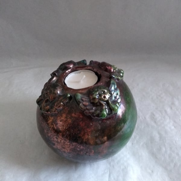 CERAMIC CANDLE HOLDER  RAKU FIRED WITH 4 DECORATIVE ANGELS 12 CMS HIGH