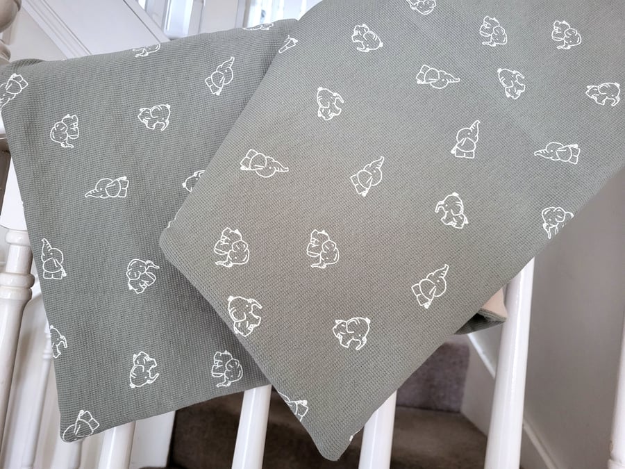Beautiful handcrafted baby blanket featuring baby elephants