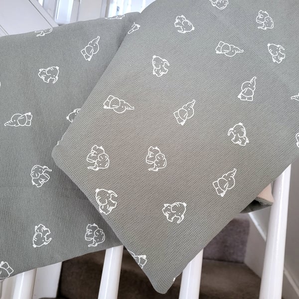 Beautiful handcrafted baby blanket featuring baby elephants