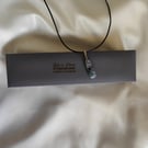 Kyanite pendant with Garnet and Emerald