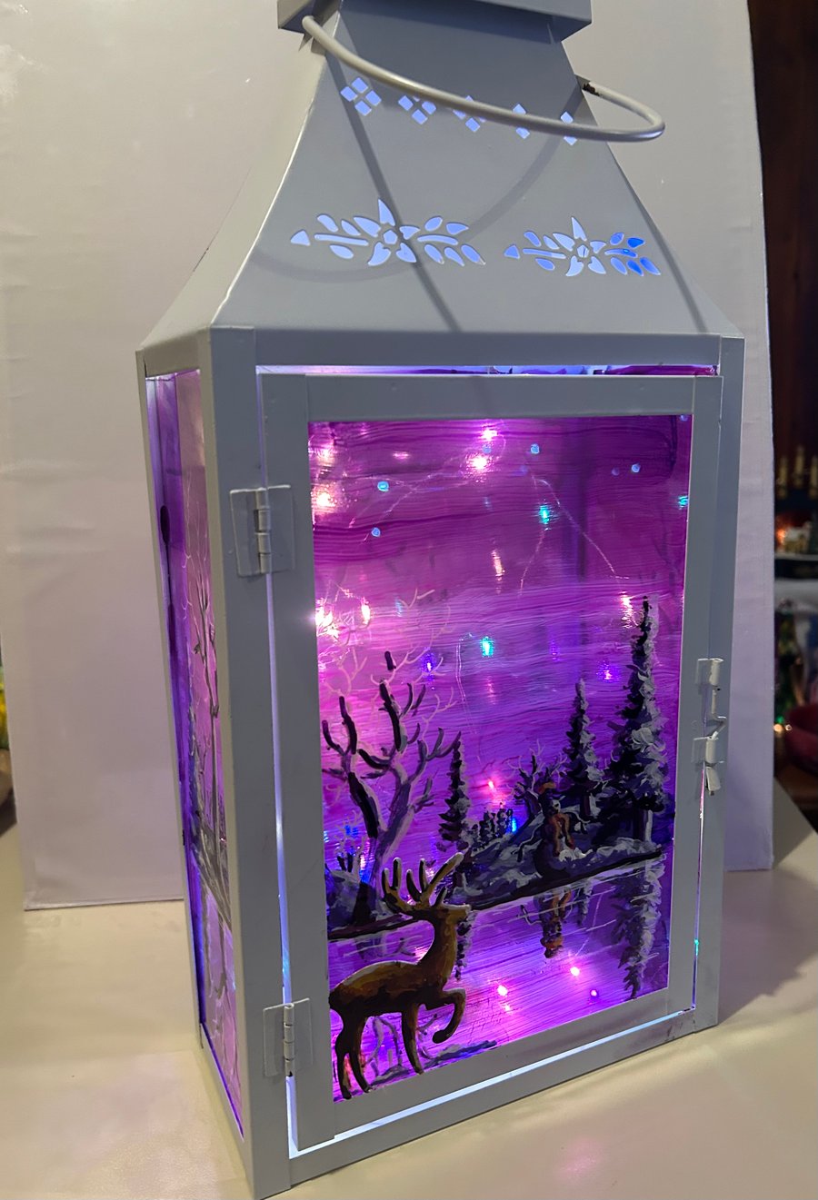 A hand painted and fired metal and glass lantern by Andrew Jenkins 