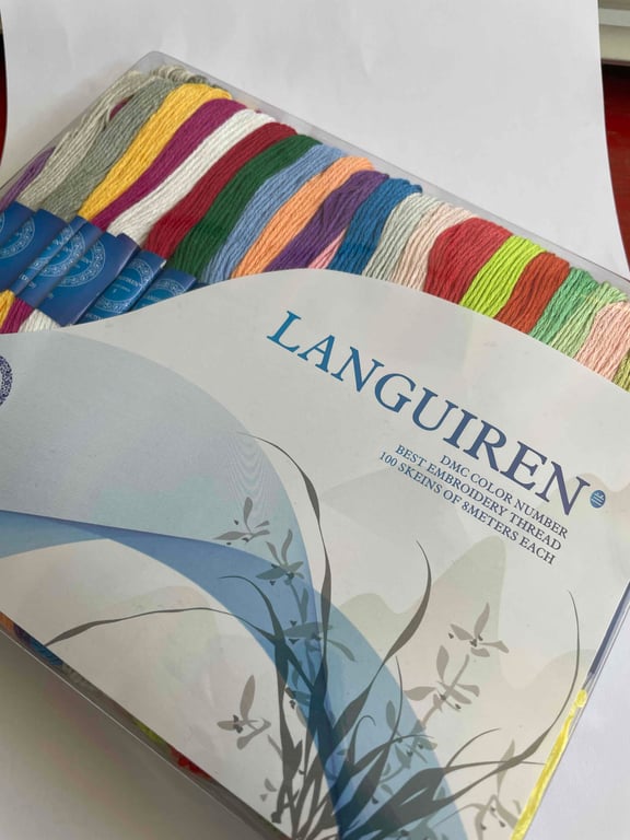 100 skein of cotton embroidery thread. Multi-coloured in a box...