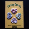 set of four crackled ceramic heart buttons