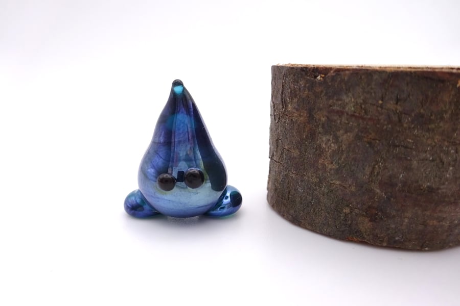 small glass wisp figure