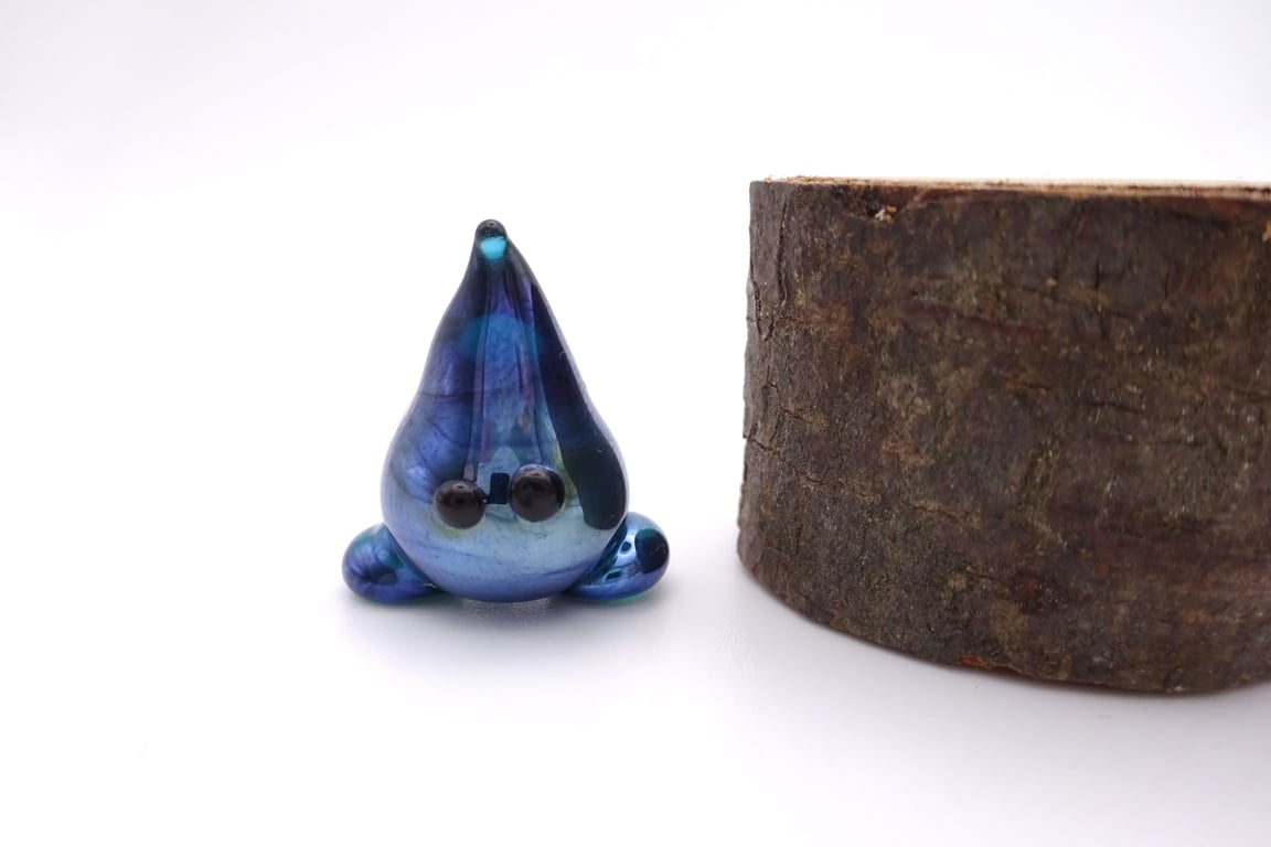 small glass wisp figure