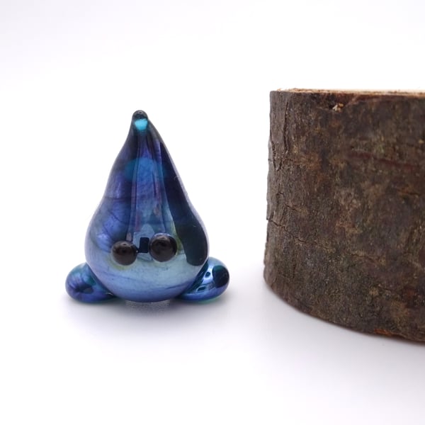 small glass wisp figure