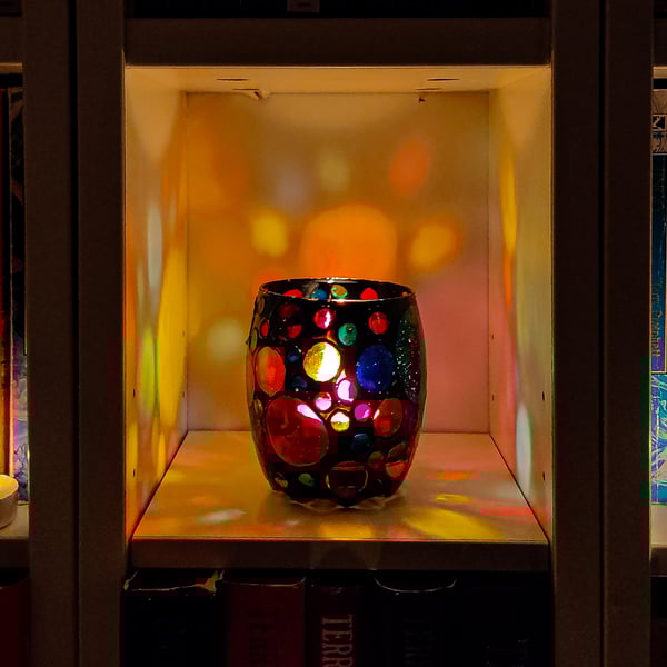 Stained glass effect painted tea light holder with multi-coloured circles 