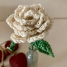 Cream crochet rose in an antique bottle