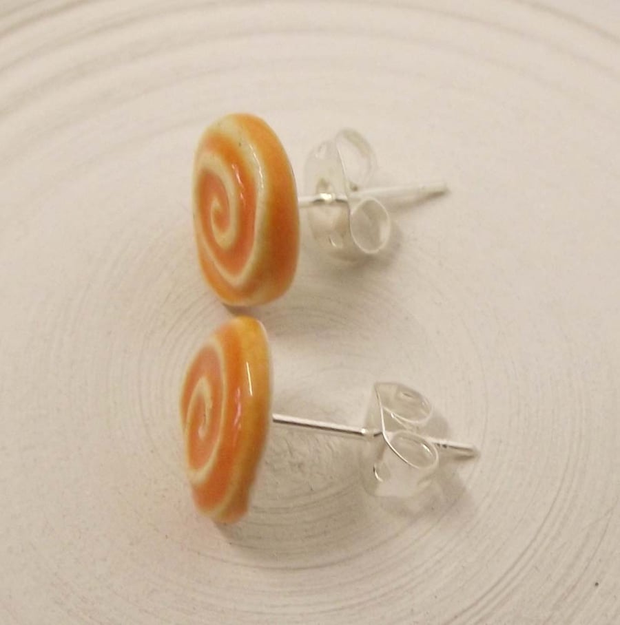 Tiny, swirly ceramic stud earrings