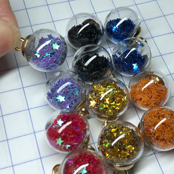 12 star filled glass bauble pendants darker colours