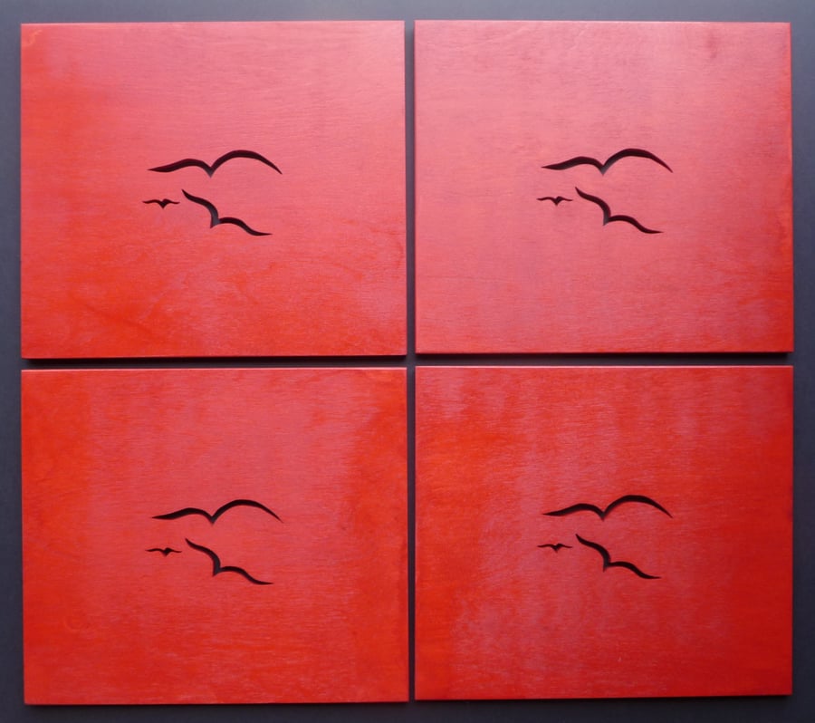 Set of 4 red Seagull placemats. 