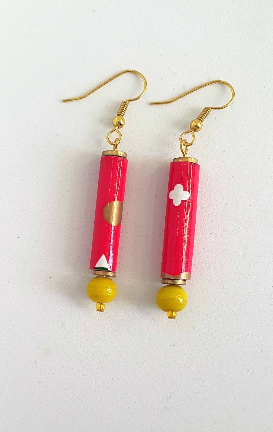 Long red paper beaded earrings with yellow bottom bead