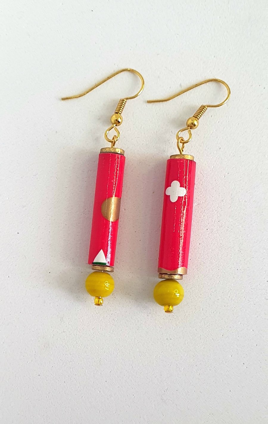 Long red paper beaded earrings with yellow bottom bead