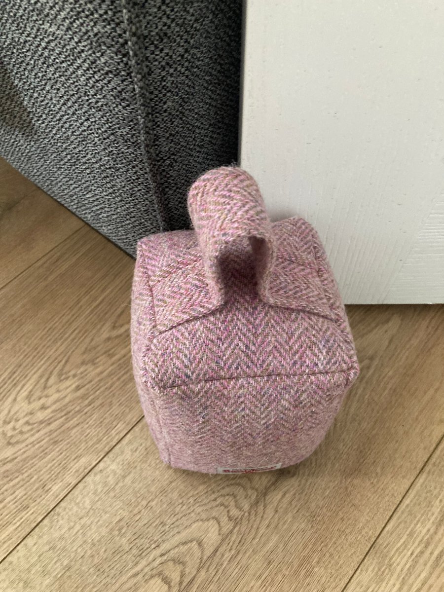 A pink and green Harris Tweed doorstopper
