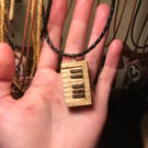 Hand Carved Casio Keyboard Pendant 