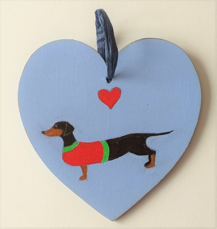 Dinky the Dachshund on a wooden heart shape