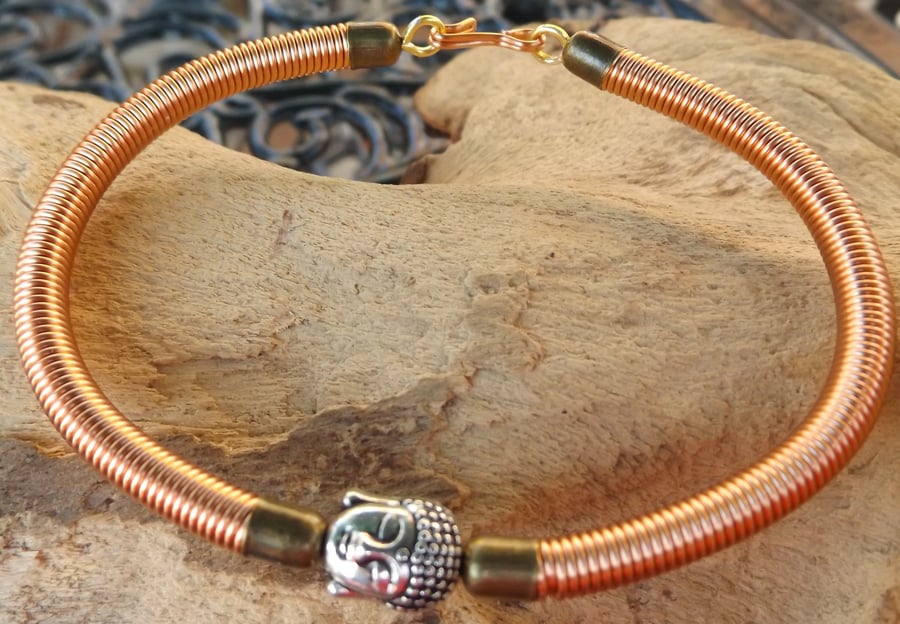 7.5" copper wire bracelet with copper gizmo wire cover and buddha charm